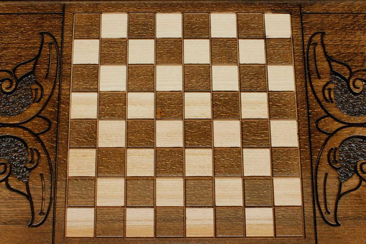 The backgammon board opened to show the wooden playing surface