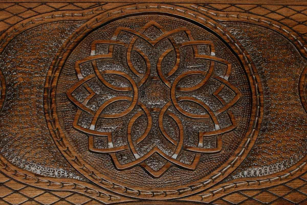Detail of the cross-hatched carved ground