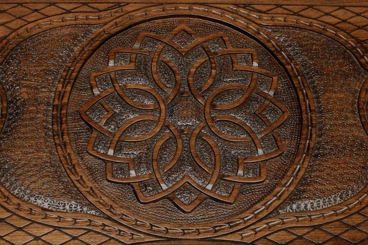 Detail of the cross-hatched carved ground