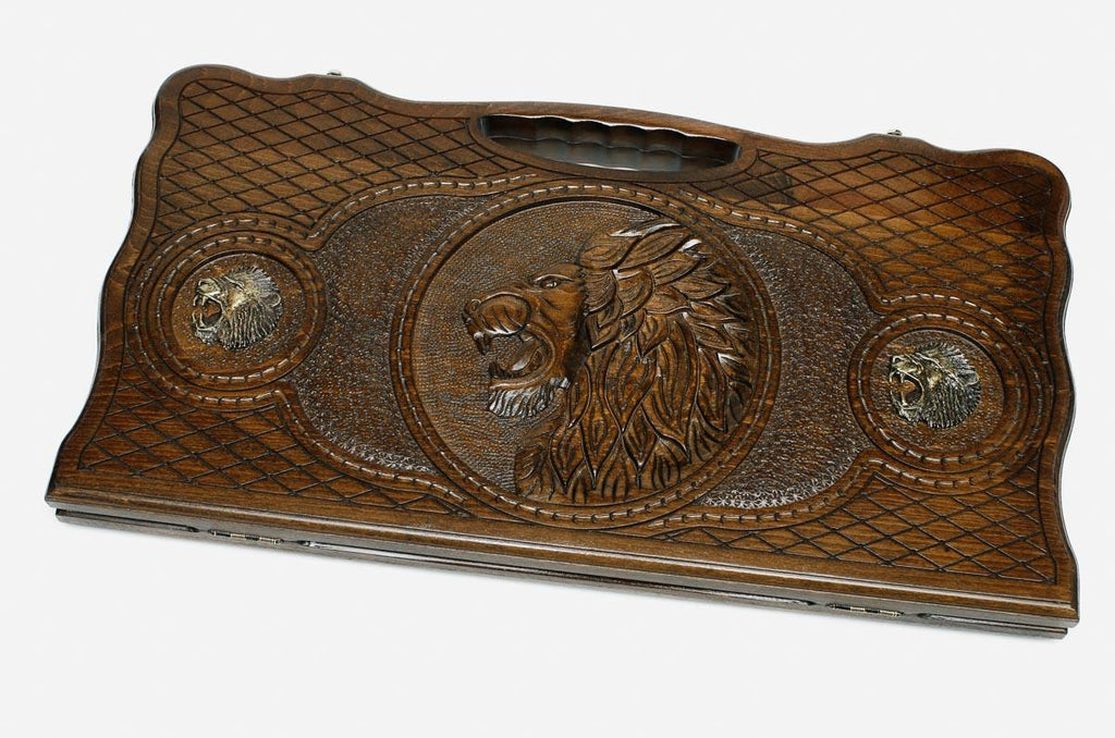 Carved beechwood backgammon board with a lion and a wolf and bronze details, propped open