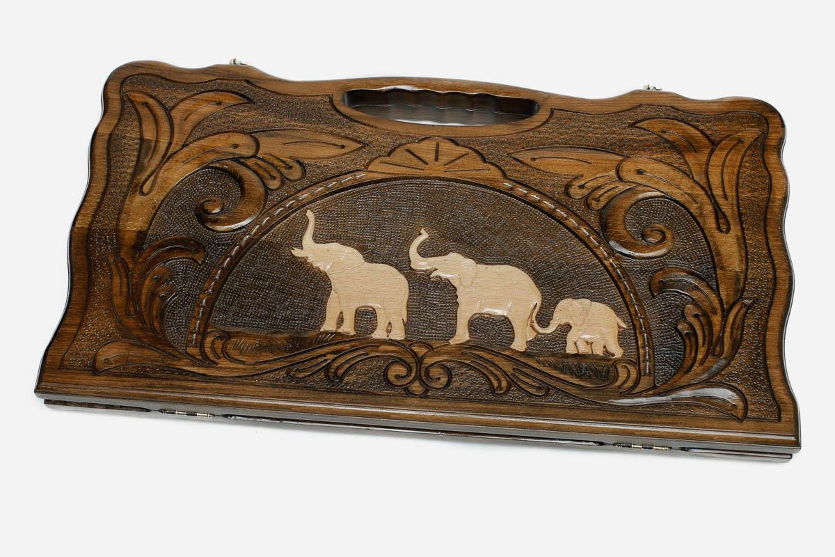 Carved beechwood backgammon board with a family of elephants and a carry handle, propped open