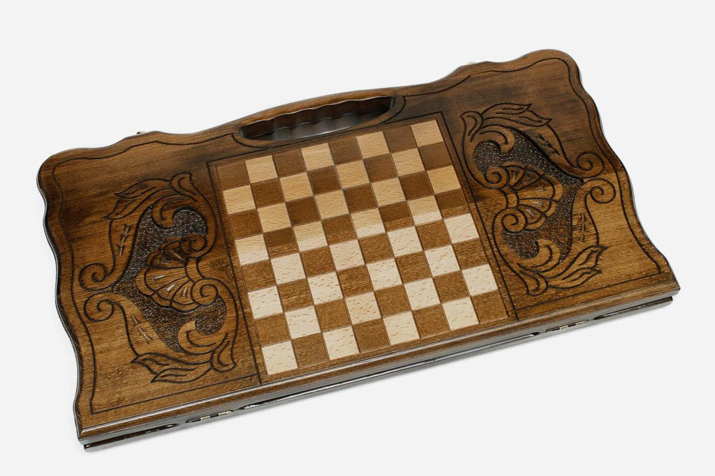 Angled view of the elephant family carved backgammon board