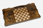 Angled view of the elephant family carved backgammon board
