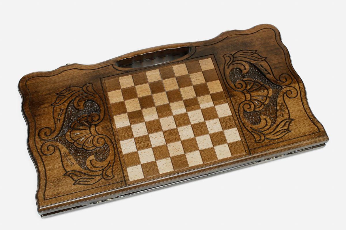 Angled view of the elephant family carved backgammon board