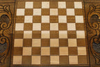 The backgammon board opened to show the wooden playing surface
