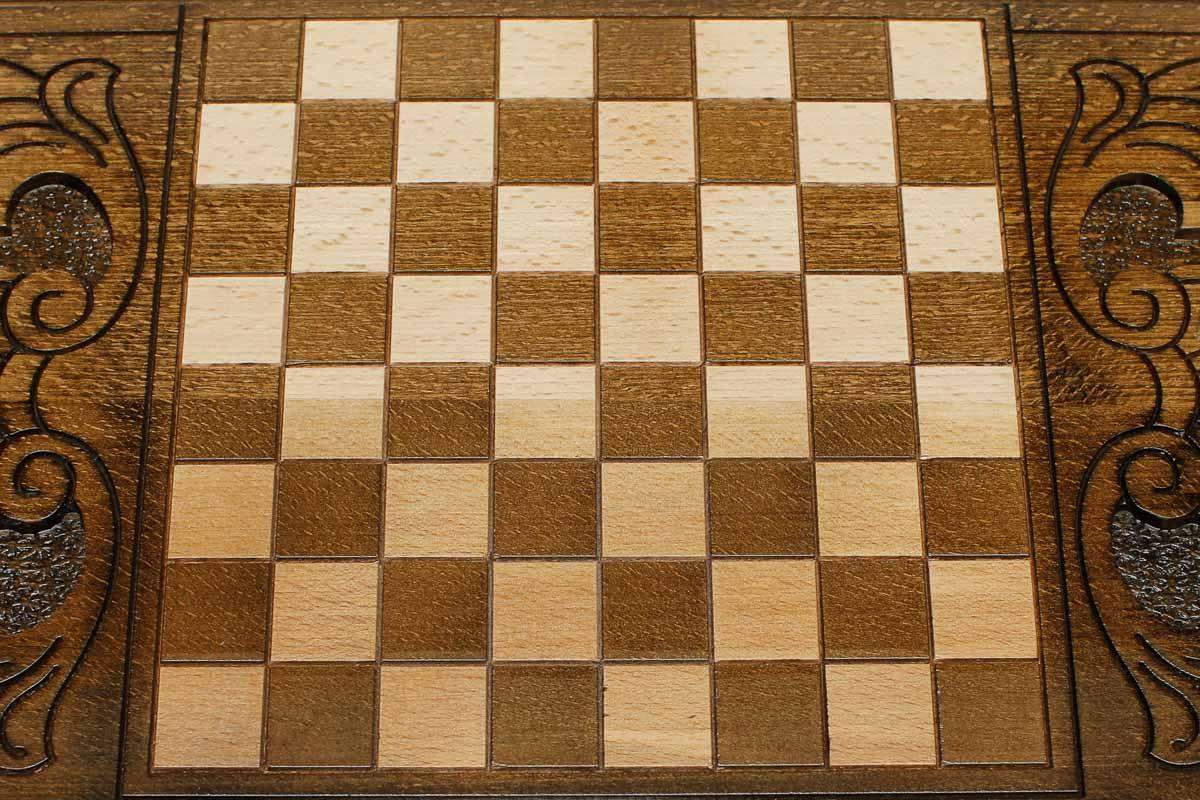The backgammon board opened to show the wooden playing surface