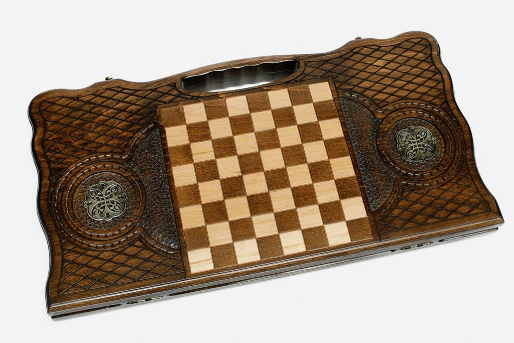 The backgammon board opened to show the wooden playing surface