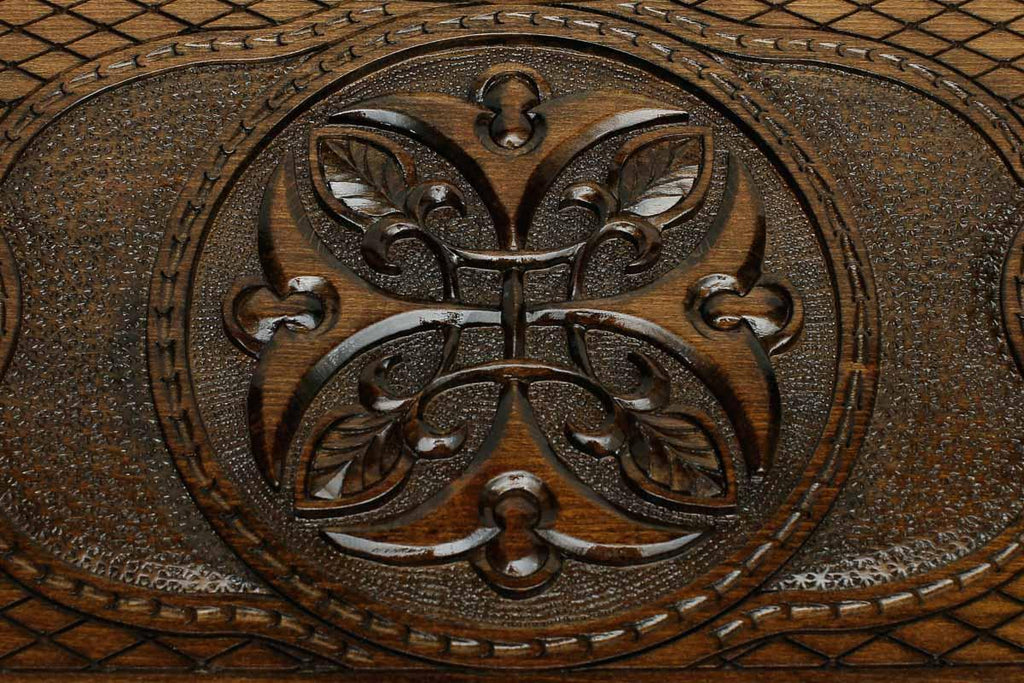 Detail of the cross-hatched carved ground