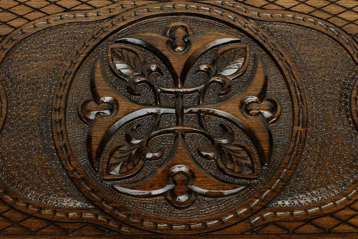 Detail of the cross-hatched carved ground