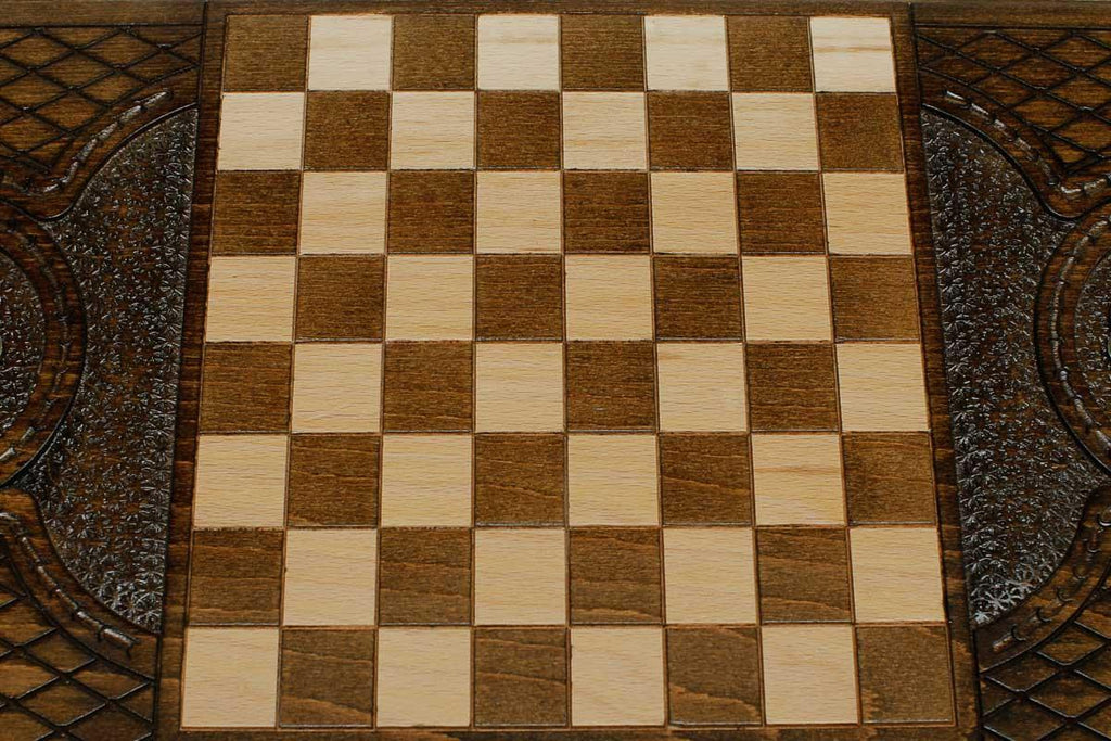 Angled view of the floral ornament and bronze backgammon board