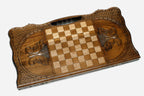 The backgammon board opened to show the wooden playing surface