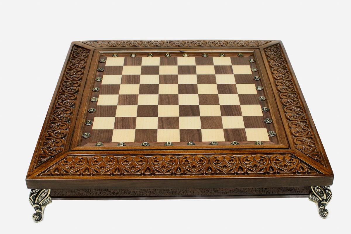 Fine hand-carved detailing on a luxury chess board - close-up