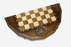 Angled view of the Russian coat of arms chess set with its bright and darkened bronze armies