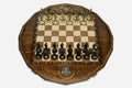 Luxury twelve-sided Russian chess set with an inlaid double-headed eagle and ornate bronze pieces set up for play