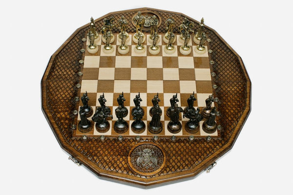 Luxury twelve-sided Russian chess set with an inlaid double-headed eagle and ornate bronze pieces set up for play