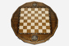 Overhead view of the lattice-carved board and the full set of 32 wooden pieces