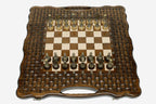 Luxury chess set with bronze pieces on a hand-carved lattice board