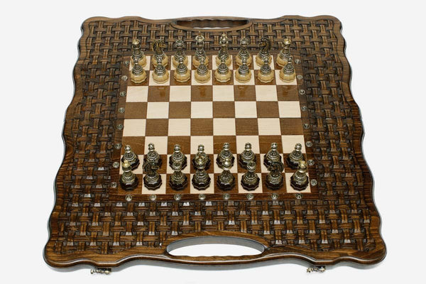 Luxury chess set with bronze pieces on a hand-carved lattice board