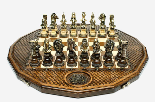 Luxury twelve-sided Armenian chess set with an inlaid coat of arms and ornate bronze pieces set up for play