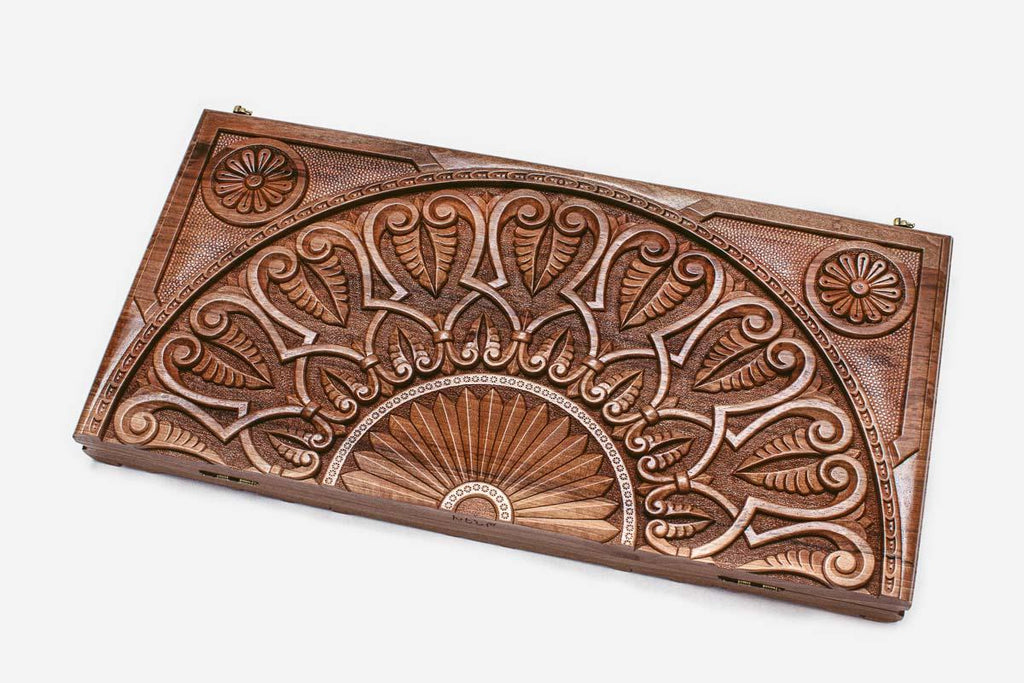 The backgammon board opened to show the wooden playing surface