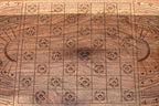 The backgammon board opened to show the wooden playing surface