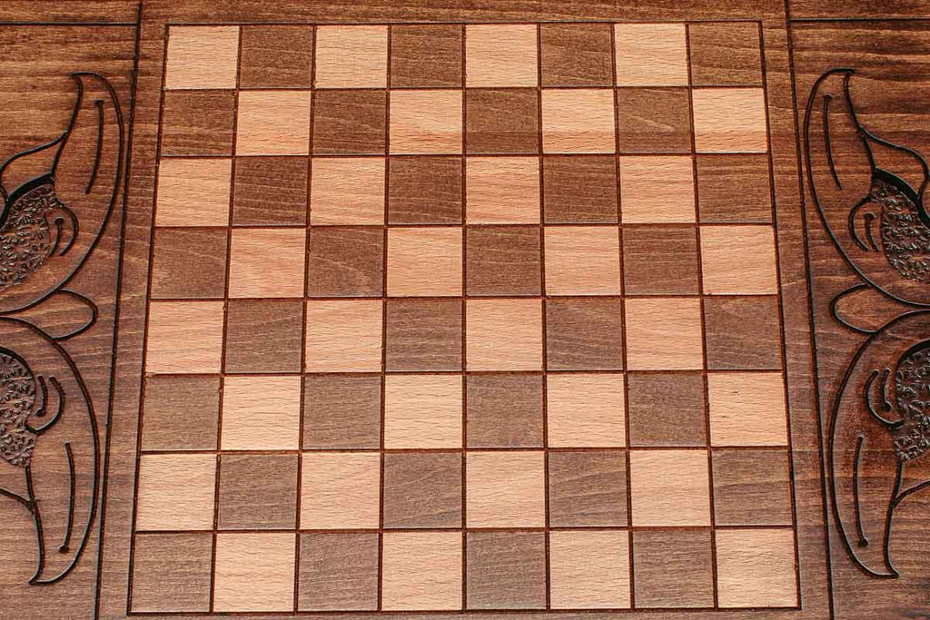 The backgammon board opened to show the wooden playing surface