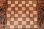 The backgammon board opened to show the wooden playing surface