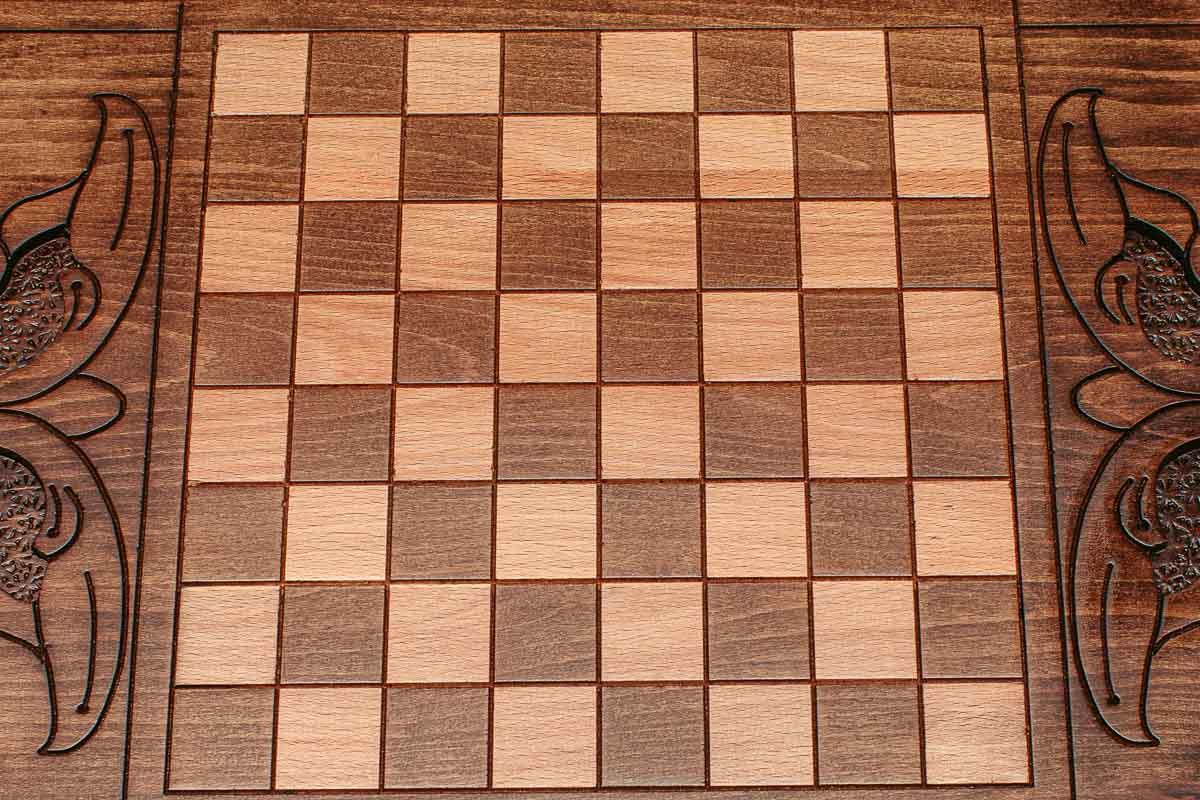 The backgammon board opened to show the wooden playing surface