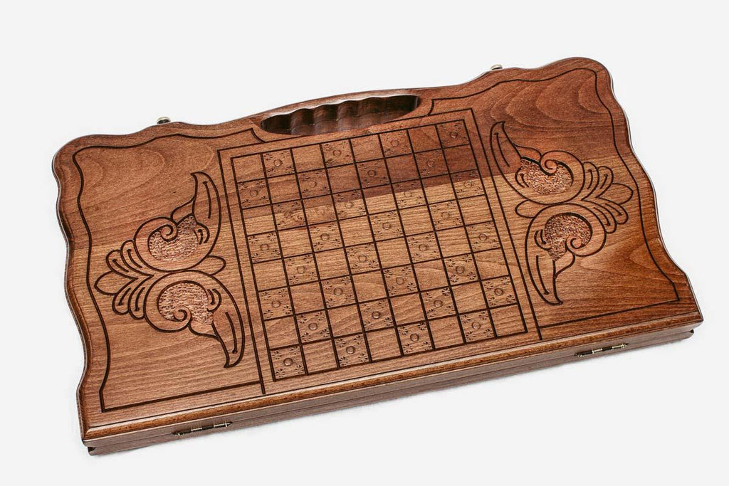Angled view of the carved horse backgammon board
