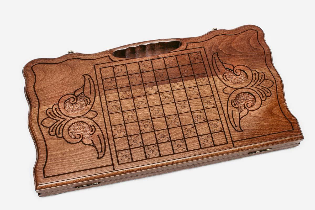 Angled view of the carved horse backgammon board