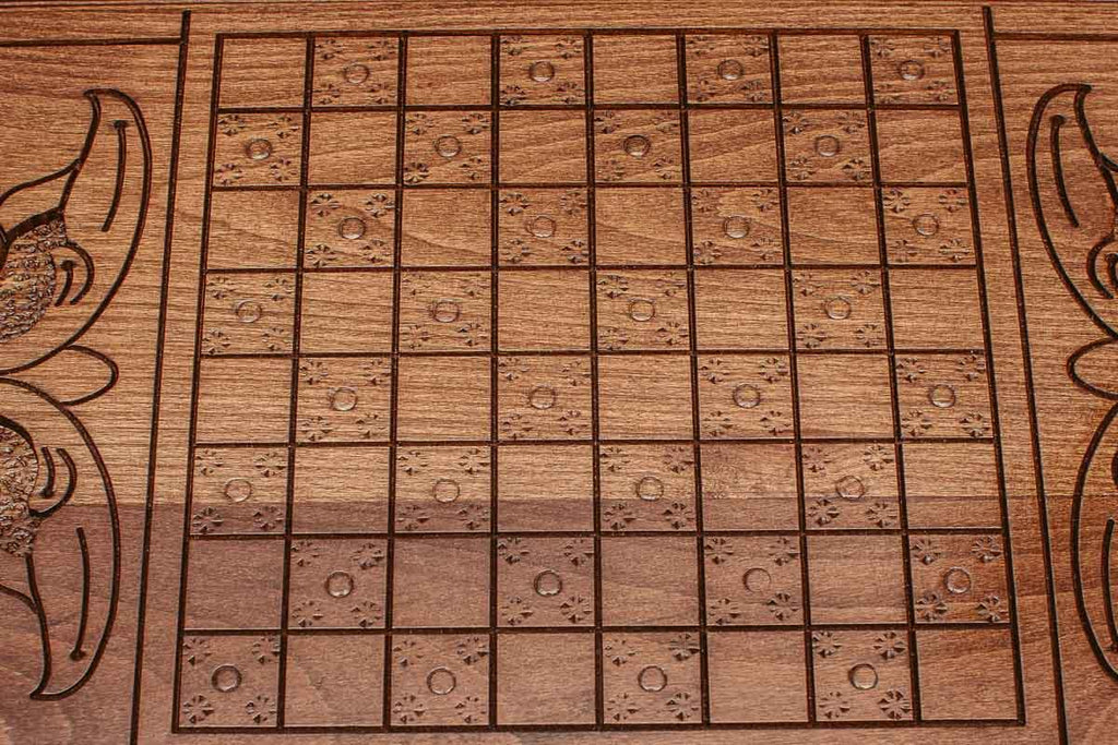 The backgammon board opened to show the wooden playing surface