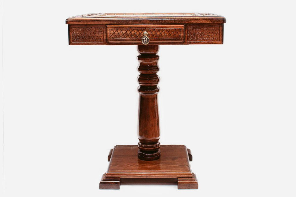 Carved wooden chess table with bronze army, angled view