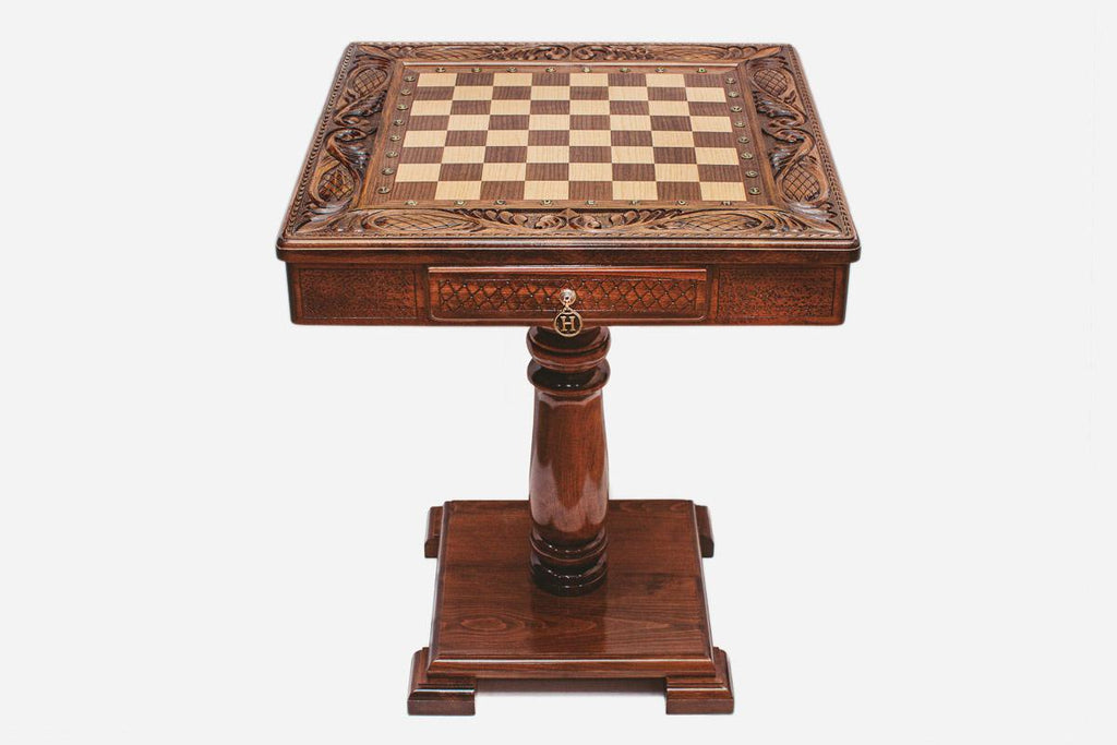 Hand-carved chess table on its pedestal, side profile