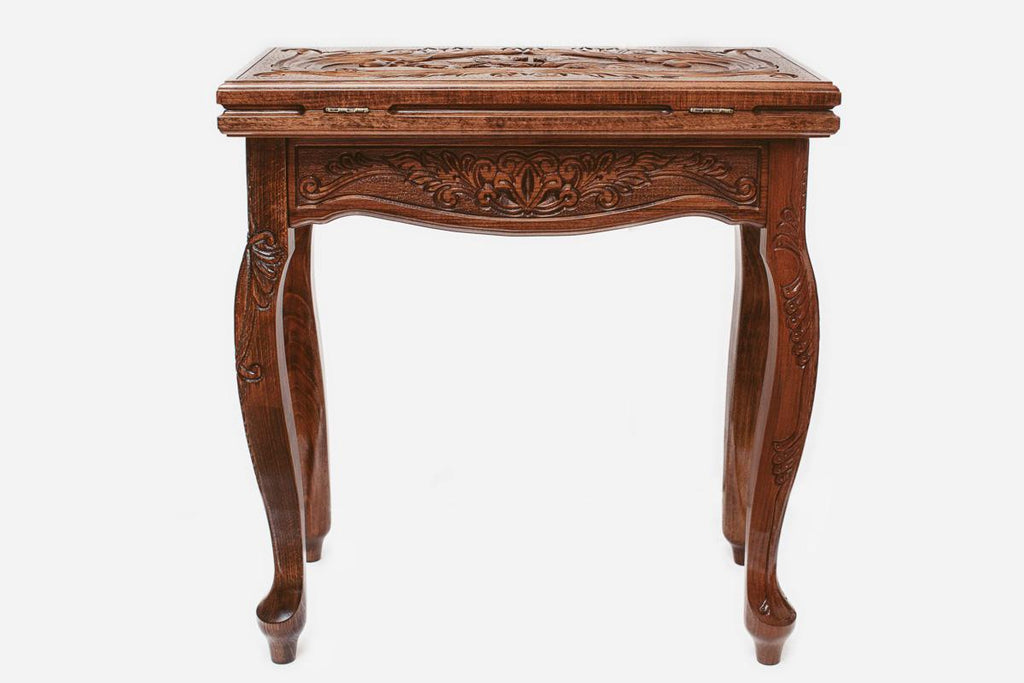 Facing lions backgammon table closed, straight front view of the carved scrollwork lid