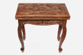 Facing lions backgammon table closed, front elevation showing the carved lid and legs