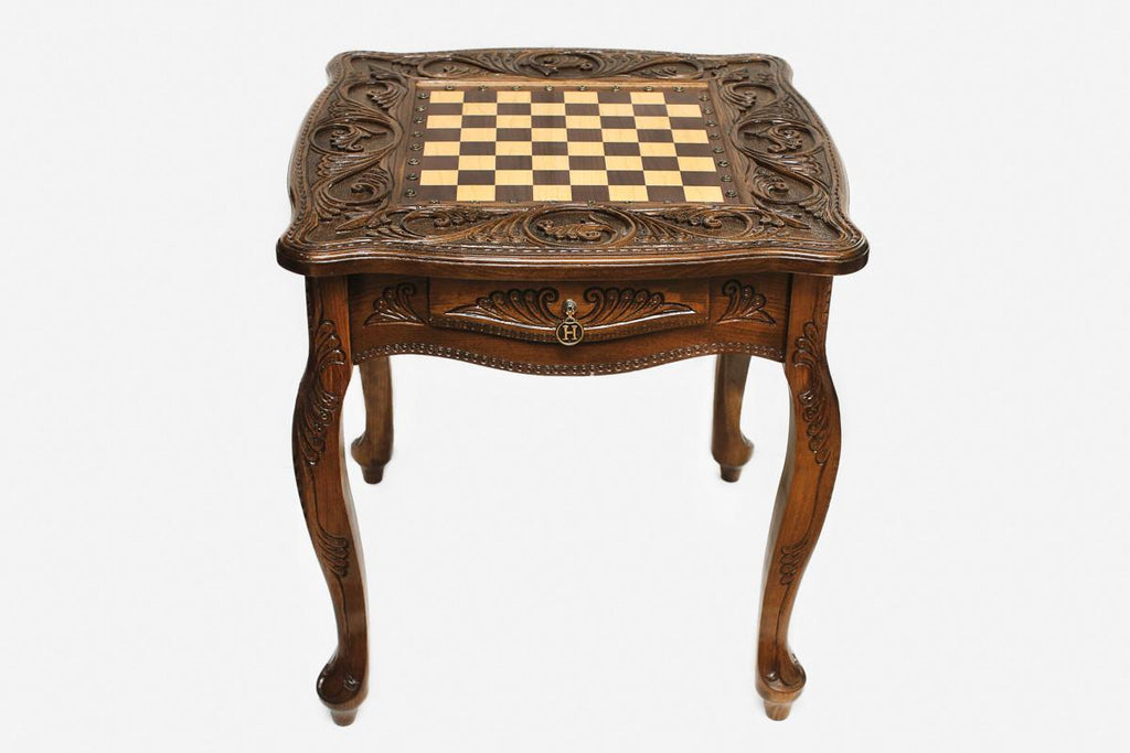 Close-up of the fine hand-carving on the beech tabletop