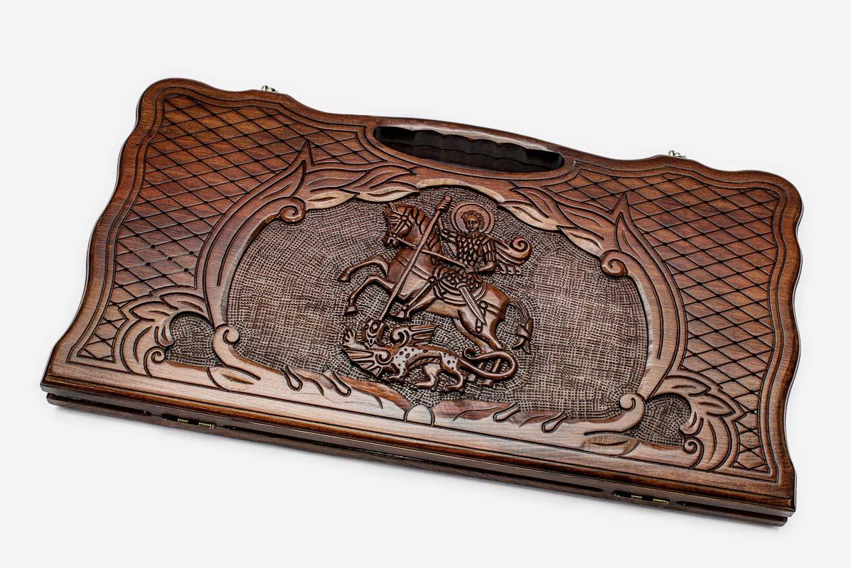 Carved beechwood backgammon board with Saint George slaying the dragon, propped open