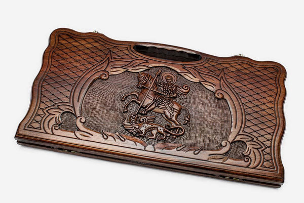 Carved beechwood backgammon board with Saint George slaying the dragon, propped open