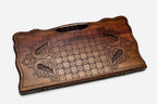 The backgammon board opened to show the wooden playing surface