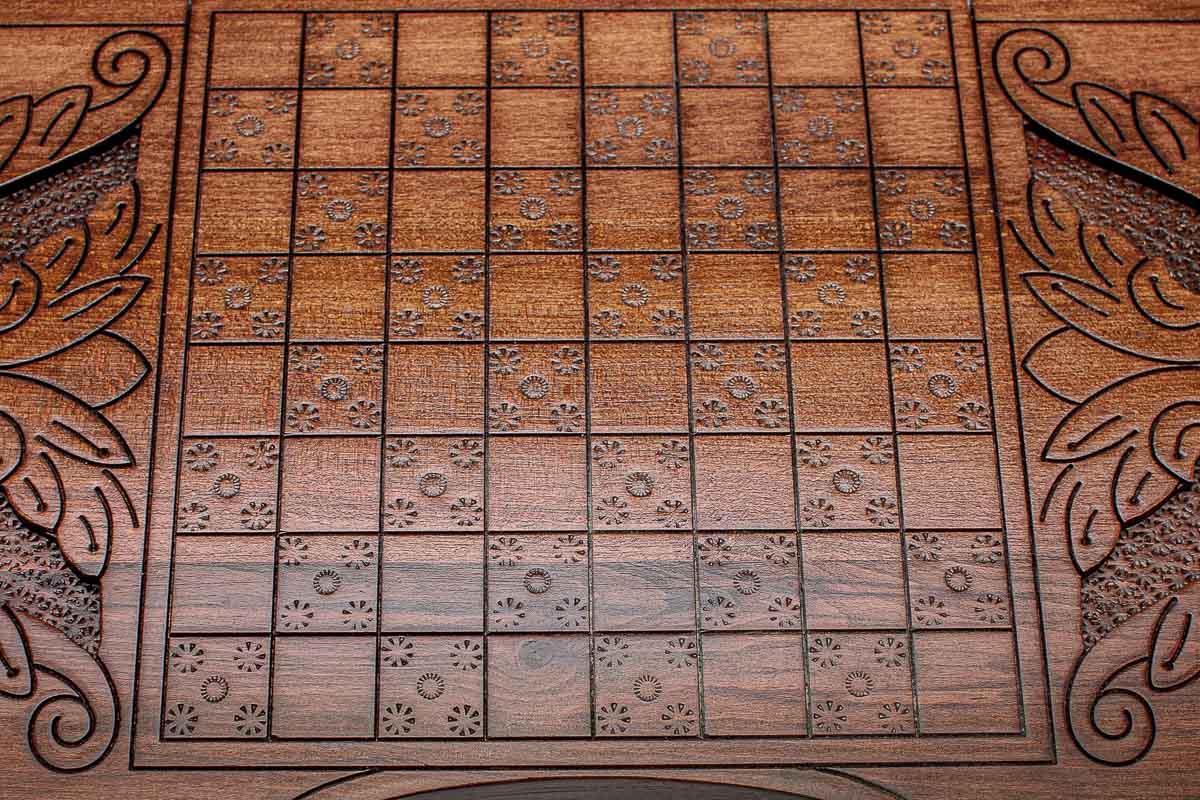 Angled view of the Saint George carved backgammon board