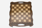 Close-up of the turned chess pieces on the maple and walnut inlaid squares