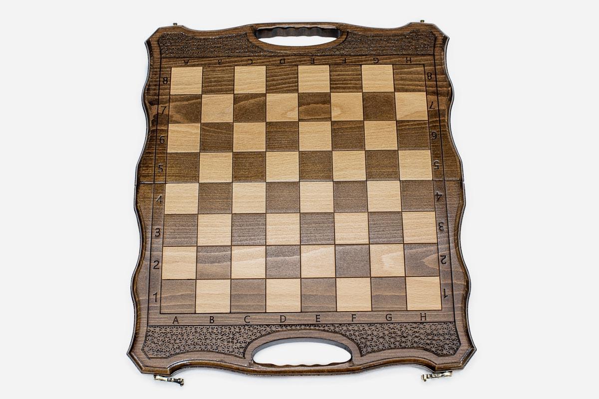 Close-up of the turned chess pieces on the maple and walnut inlaid squares