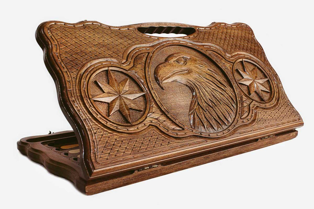 Carved beechwood backgammon board with an eagle in an octagonal star ornament and a carry handle, propped open