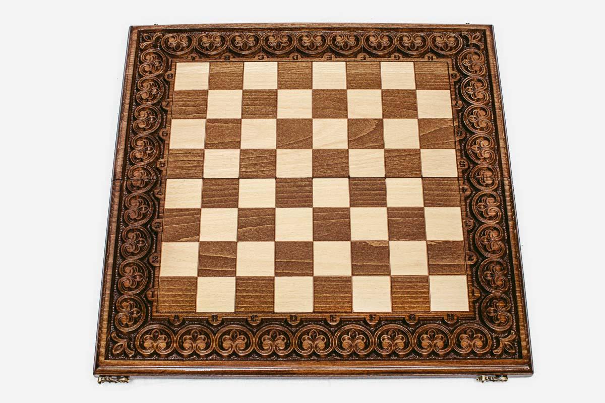 Floral ornament framing the wooden chessboard