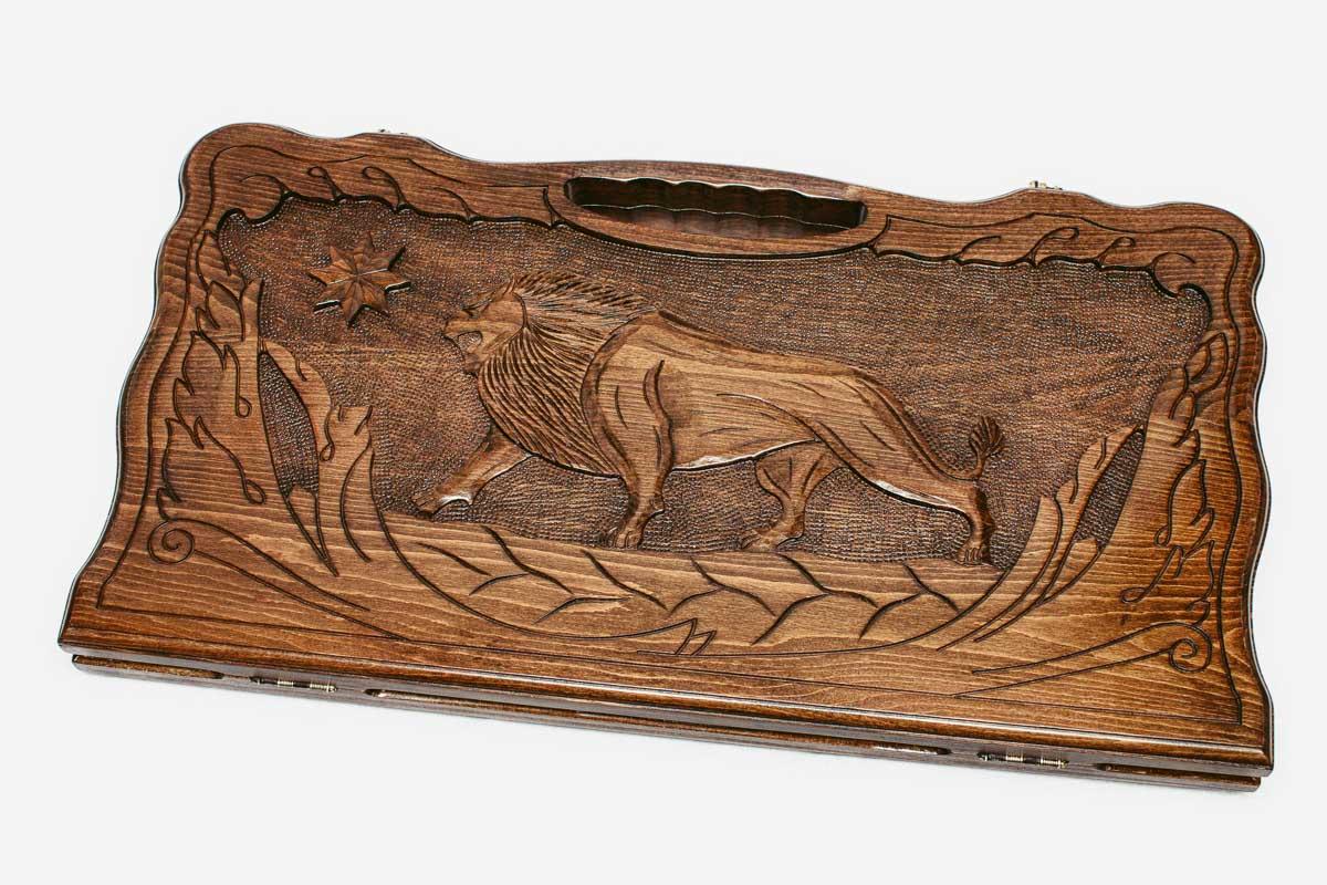 Angled view of the lion and octagon carved backgammon board