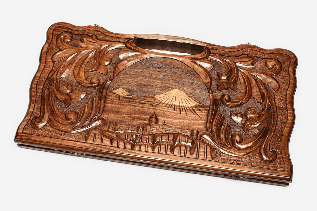 The backgammon board opened to show the wooden playing surface