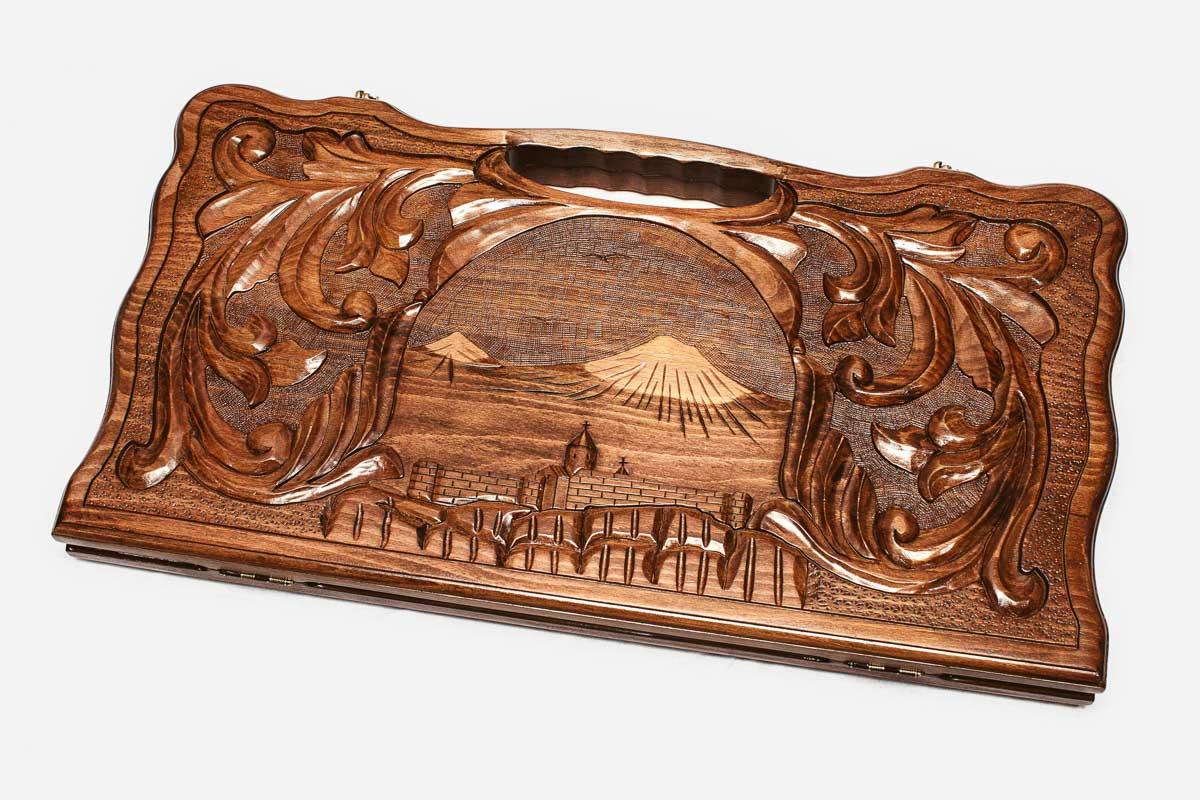 The backgammon board opened to show the wooden playing surface