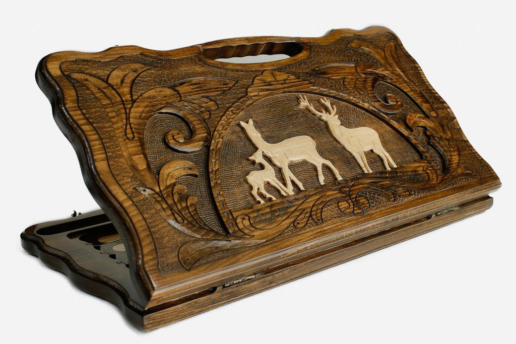 Carved beechwood backgammon board with a pair of deer in an oval frame, propped open