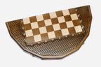 The sixteen-sided board shown half-open, revealing the shape of its cut edges