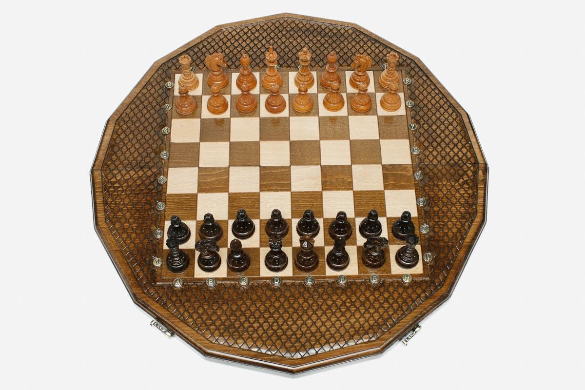 Luxury sixteen-sided chess set with lattice-carved borders and turned wooden pieces set up for play
